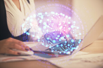 Multi exposure of woman hands working on computer and human brain hologram drawing. Ai tech concept.