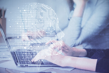 Fototapeta premium Multi exposure of woman hands working on computer and brain hologram drawing. Ai concept.