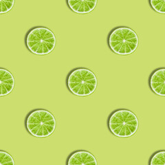 Seamless pattern with lime on a green background. Lime slices seamless texture for the design.
