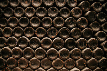 bottles of old wine in dusty cellars. old bottles of in wine cellar