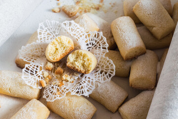 Sweet sugar powdered homemade cookies on white background, selective focus