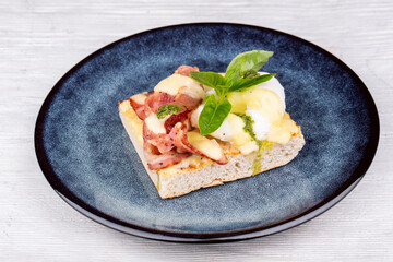 hot sandwich with bacon and pashot egg
