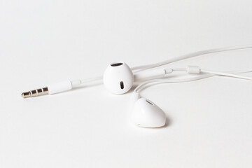 White headphones with a wire