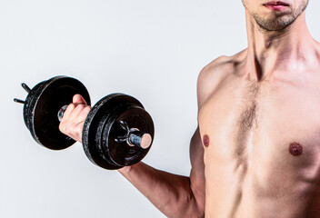 Fototapeta na wymiar Weak man lift a weight, dumbbells, biceps, muscle, fitness. Nerd maleraising a dumbbell. Man holding dumbbell in hand. Skinny guy hold dumbbells up in hands. A thin man in sports with dumbbells