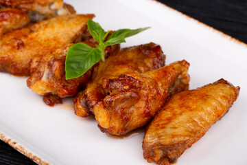 chicken wings sauce, served with greens
