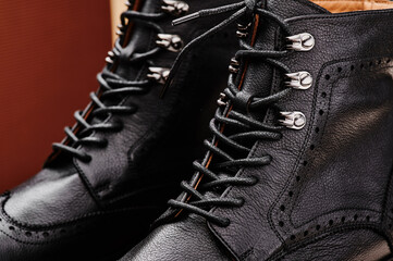 Black leather women's boots made of genuine leather in a classic style close-up. . High quality photo