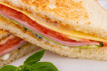 toast bread, ham, cheese, salad, cucumbers, tomatoes, sauce