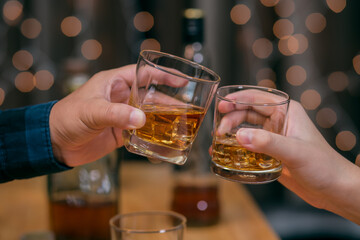 Celebrate whiskey on a friendly party in restaurant.
