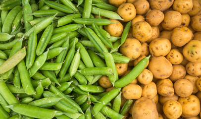 Peas and Creole potatoes in the traditional Colombian market - Pisum sativum, Solanum phureja