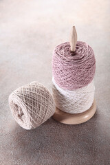 Multicolored cotton yarn for hand knitting.Tangle stand.Vertical photo. Top view.Copy space.
