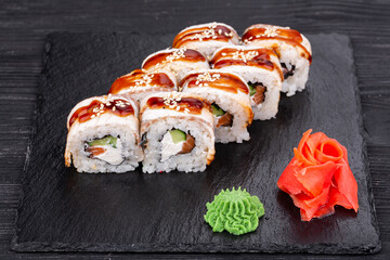 Roll with eel, Eel, salmon, cucumber, cheese, sesame and unagi sauce