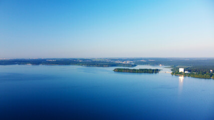 Aerial view of blue lake water landscape at sunrise