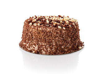 Whole cake with shavings of white and dark chocolate isolated on white background. Water droplets condensed on the chocolate cake when it was taken out of the refrigerator on a hot day.