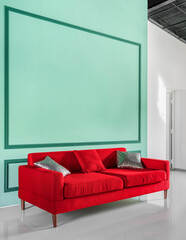 Colorful furniture in the interior. Red sofa in the living room against the background of a turquoise wall. Vertical photo. High quality photo