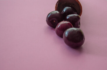 waffle cone with cherry on a pink background! Ice cream, a glass of cherries. Copy space