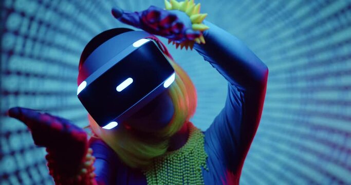 Cyberpunk style futuristic woman wear VR headset glasses with light green bob cut hair and blue skin dancing and moving on modern hitec neon backgound. Future cyber style concept. Virtual dancer.