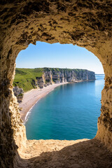 The Fourquet cliff and the Tilleul beach seen from the "Grotte d'Amour" cavity in Etretat, France