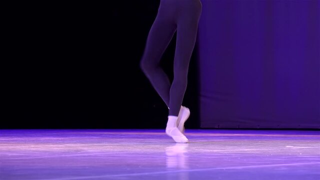 Feet of the male danser during the ballet  rehearsal.