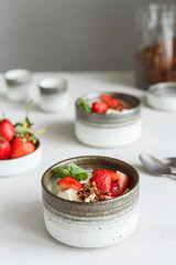 Strawberry, cream cheese and feta cream and crumble crust dessert. Homemade Sweet and salty cheesecake. Trifle. Selective focus