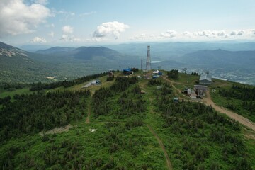 the top of the ski resort under construction in summer. Panoramic view in the summer sunset to the ski resort. Sheregesh