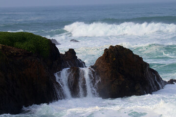 waves crashing over rocks