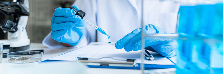 Science experiment. Health care researchers working in life science laboratory
