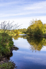 The River Irthing flowing past the village of Irthington, Cumbria UK