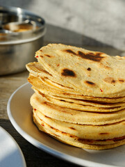 Pile of traditional Indian corn flatbreads Makki ki roti.