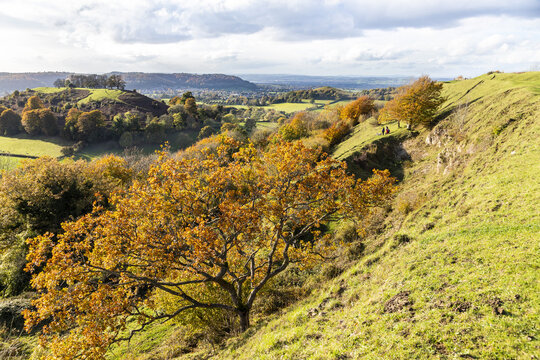 A view towards Downham Hill, Dursley & Cam Peak from the Iron Age ramparts of Uley Bury a large multivallate hillfort on a spur of the Cotswold escarpment at Uley, Gloucestershire UK