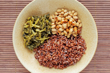 Natto soybeans with rice and pickled vegetables meal top view. Japanese cuisine.
