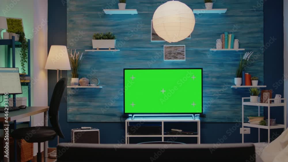 Poster green screen design on television in empty room at modern flat. chroma key digital concept on monito