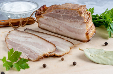 Smoked bacon slices, peppercorns, bay leaves, salt and herbs