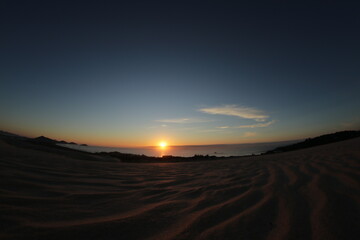 Sunrise on the dunes in beach.