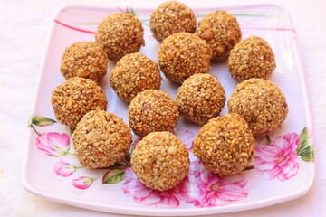 Tilgul is a colourful sesame candy coated with sesame seeds ,people exchange tilgul on Sankranti. in Maharashtra (india).The sweet is a mixture of sesame seeds (called 