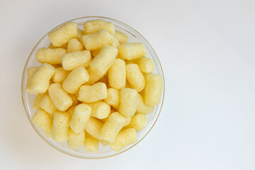 sweet corn sticks in bowl isolated on white background