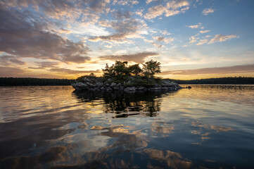 Sunset at Tugboat Island, located in Portage Bay on Eagle Lake, Northwest Ontario, Canada.