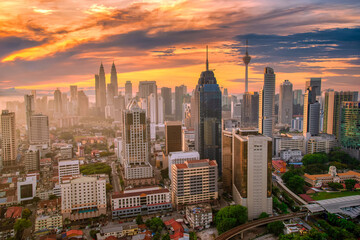 Cityscape of Kuala Lumpur city skyline at sunset in Malaysia.