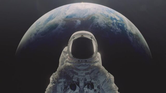 Dolly in shot of an astronaut with planet Earth n the background.