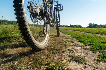 Bicycle on a field with green grass