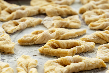On a baking sheet there are cookies with cottage cheese.