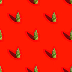 Christmas layout with natural green pine cone on red background. New Year holiday seamless pattern