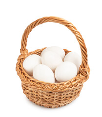 white eggs in a wicker basket isolated on white