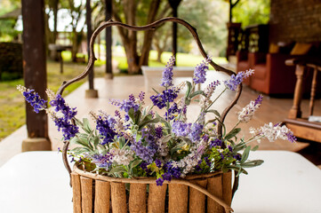 Arrangement of purple lavender flowers on garden porch.