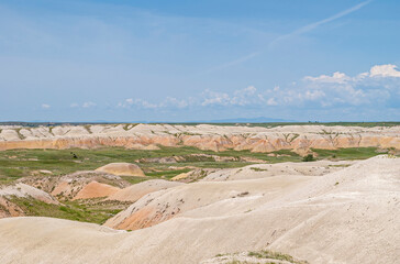 Badlands National Park, SD, USA - June 1, 2008: Wide landscape with only few green patches among...