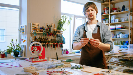 Young master with a piece of glass