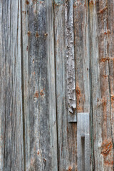 Old wooden fence gray-brown boards with cracked. Beautiful textured background for design.Old Vintage Rough Wood Bars Fence Texture Background.