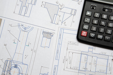 High angle view on the plan of electrical installation with calculator