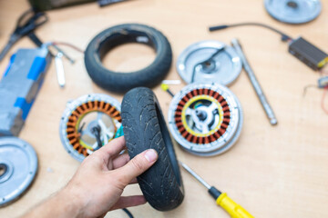 replacement of a rubber tire for an electric scooter wheel, wheel disassembly.