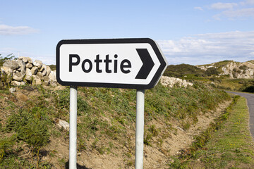 A road sign to the delightfully named hamlet of Pottie on the Isle of Mull, Inner Hebrides, Argyll...