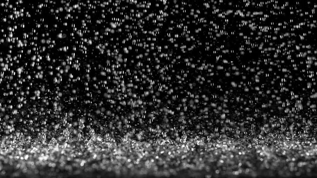 Super slow motion of dark water drops in detail. Filmed on high speed cinema camera, 1000 fps. 